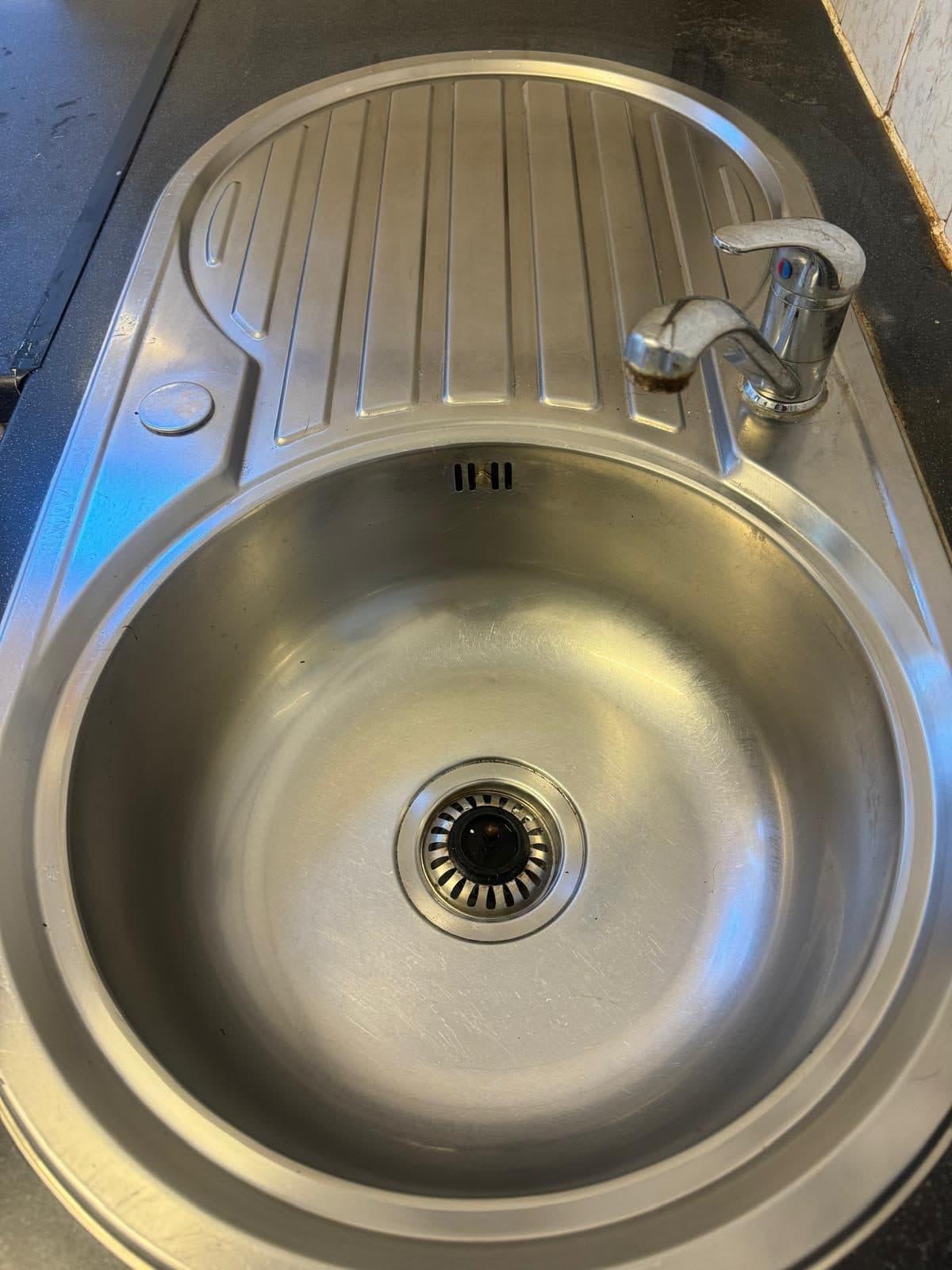 The same sink after cleaning, polished and residue-free